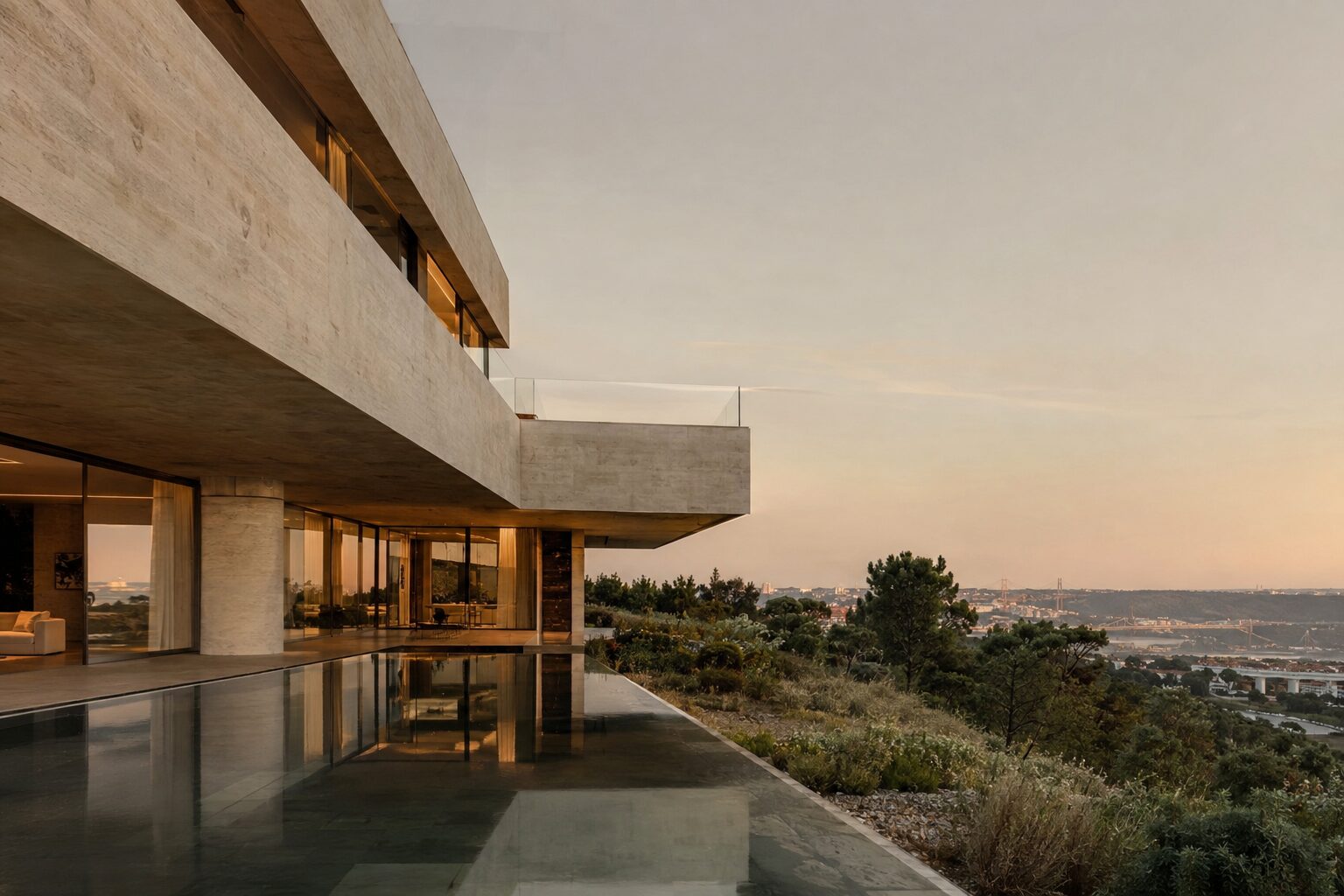 Contemporary villa in stone and glass at dusk